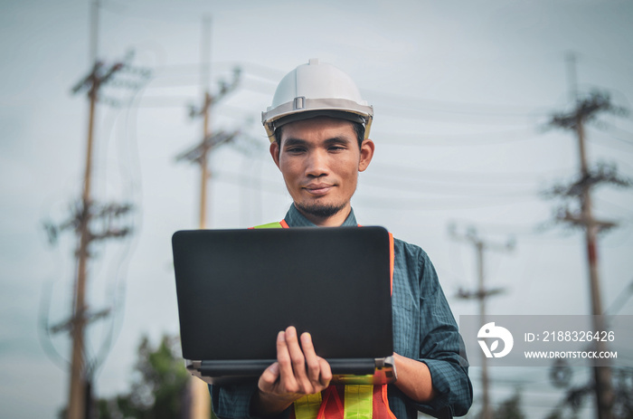 Electrical engineers use laptops at workplaces.