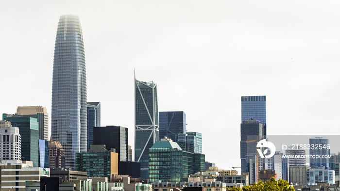 San Francisco financial district skyline, with new and modern skyscrapers, on a cloudy day; Californ