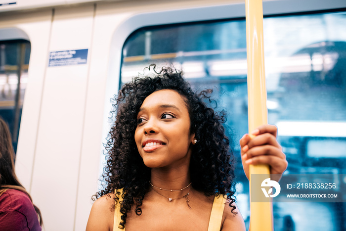 Happy black woman on London underground