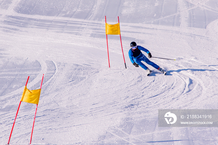 People are enjoying downhill skiing and snowboarding