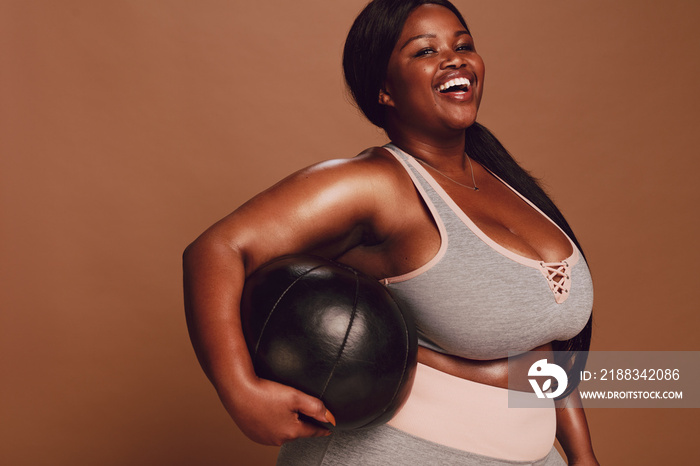 Plus size female with medicine ball