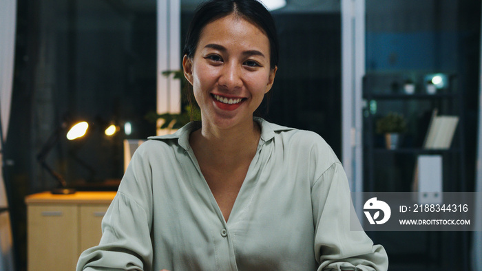 Portrait of beautiful executive businesswoman smart casual wear looking at camera and smiling, happy