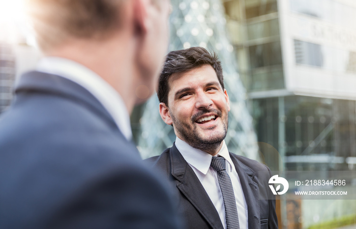 Portrait of happy success business man talk and laugh outdoor. Successful teamwork partner friendshi