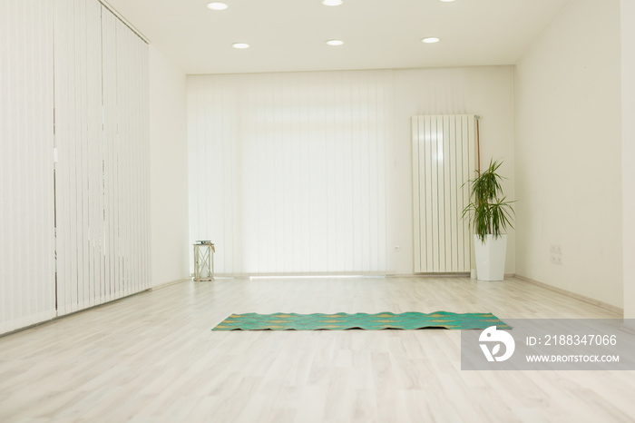 empty yoga studio, indoors white large room.