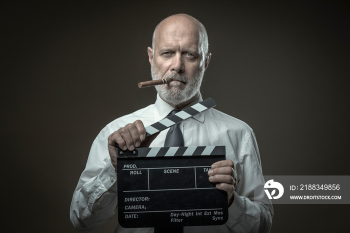 Film director holding a clapperboard