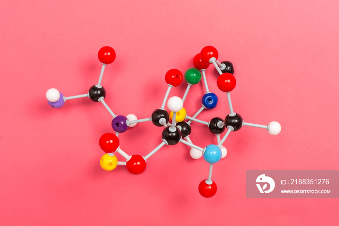 Molecule chemistry model science theme on a pink paper background