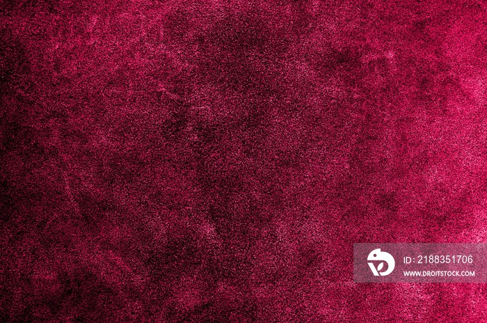 Red pink or burgundy suede texture. Leather skin natural pattern or abstract background.