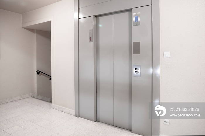 Elevator door in the entrance hall of an apartment building