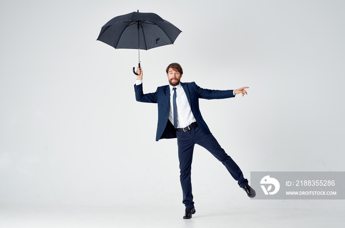 businessman with umbrella in rain