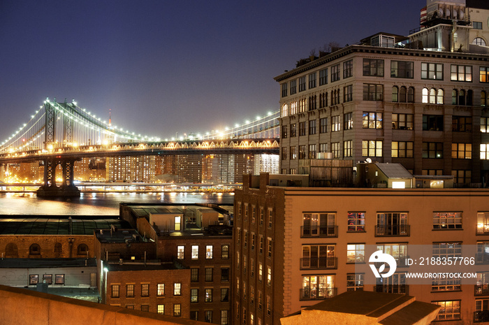 Illuminated Manhattan Bridge at dusk