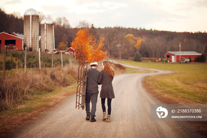 Young couple walking on rural road