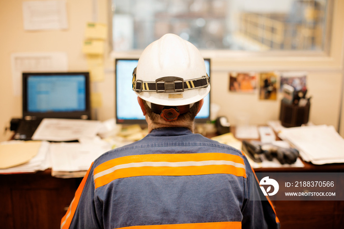 Foreman sitting in his office