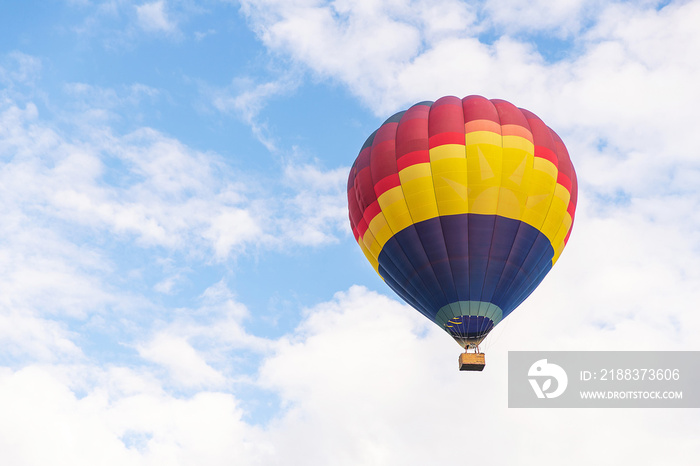 Colorful hot air balloon floating under blue sky