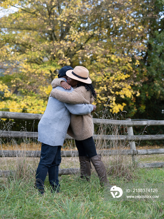 Portrait of couple embracing in nature