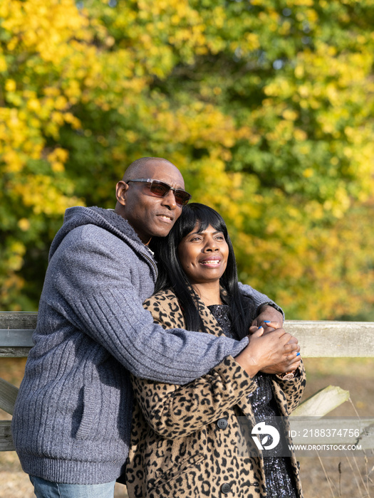 Portrait of senior couple embracing in nature