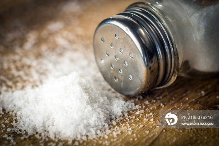 Salt on wooden background