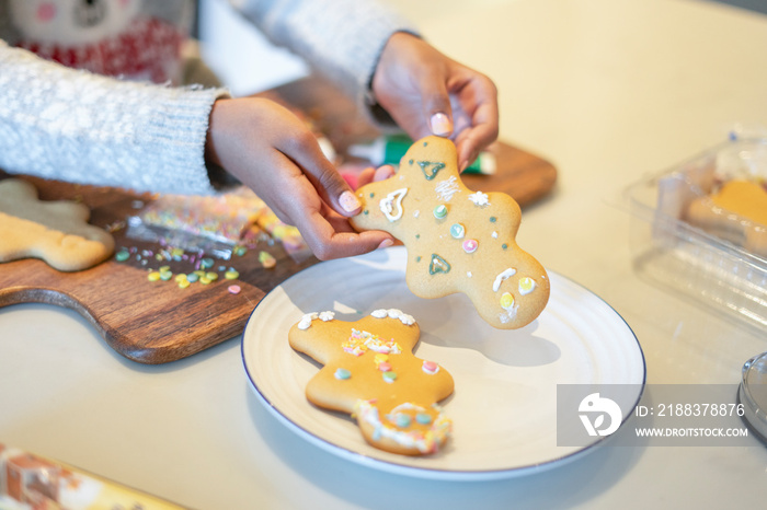 Close-up of girl holding homemade gingerbread man?