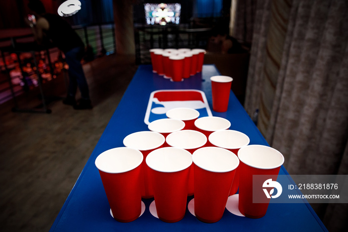 Red cups set for beer pong.