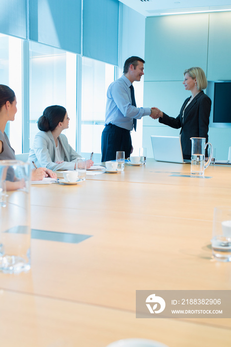 Corporate business people shaking hands in conference room meeting