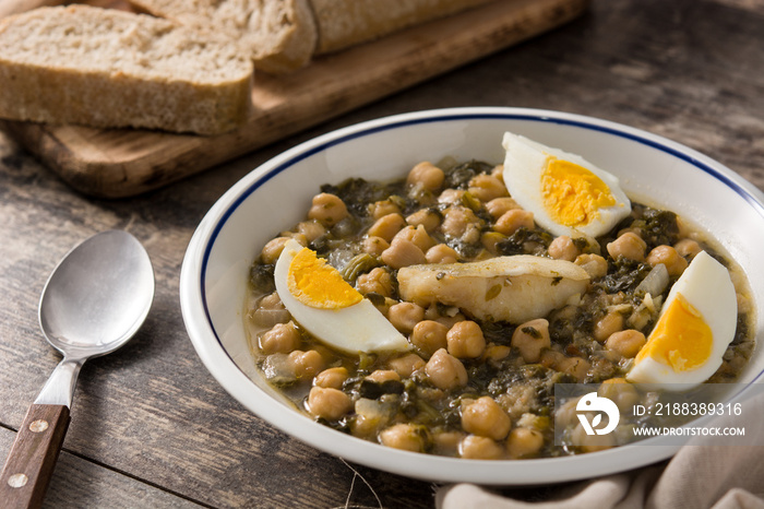 Chickpea stew with spinach and cod or potaje de vigilia. Typical spanish food for Easter holidays.