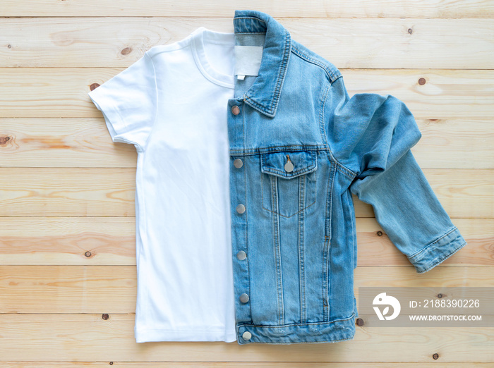 flat lay White tshirt mockup and denim jacket jeans on brown wooden background. Template,