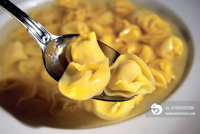 Freshly boiled tortellini with broth