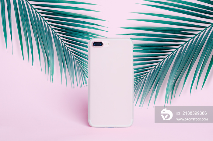 Phone case mockup isolated on a pink background of palm leaves, silicone transparent case back view,