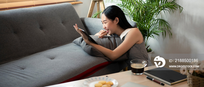 Happy Asian woman resting at home.