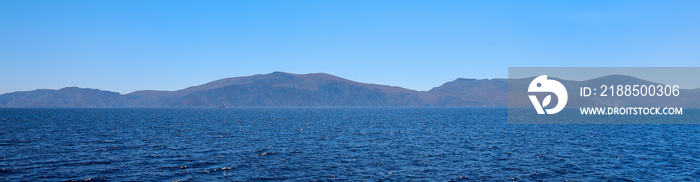 Beautiful seascape. Taken from the yacht on a sunny summer day. Saronic Gulf, Greece.