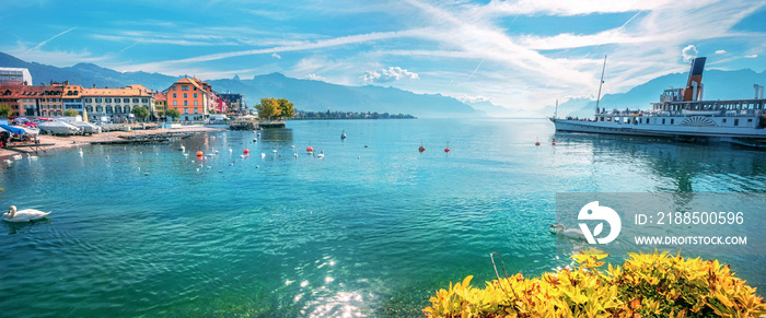 Picturesque landscape with touristic old ferry on Geneva Lake in Vevey town. Vaud canton, Switzerland