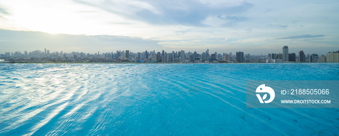 Swimming pool on rooftop of hotel apartment building in Bangkok downtown skyline, urban city view. Relaxing in summer season in travel holiday vacation concept. Recreation lifestyle.