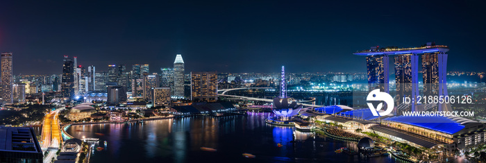 Wide panorama of Singapore skyscrapers at night