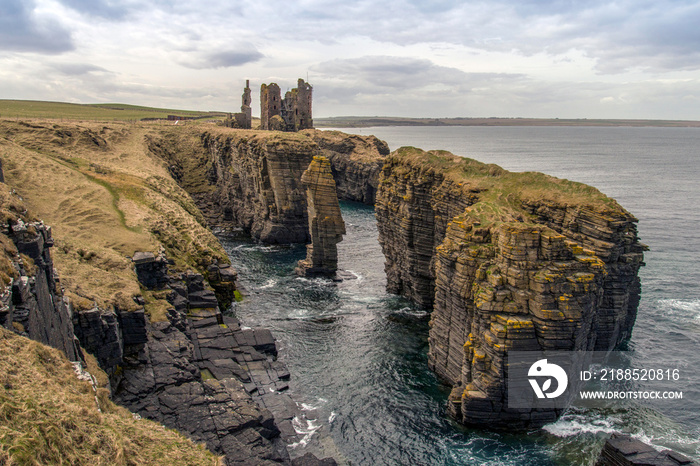 ruined castle on the caithness coast in scotland