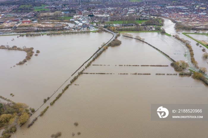 Aerial drone photo of the town of Allerton Bywater near Castleford in Leeds West Yorkshire showing the flooded fields and farm house from the River Aire during a large flood after a storm.