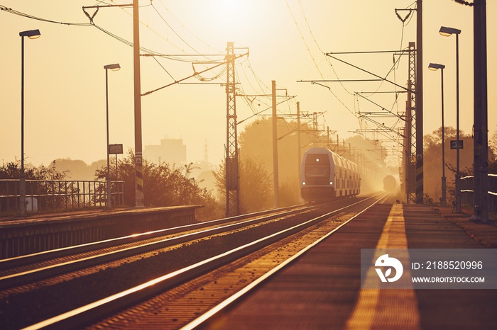 Passenger train at sunrise.