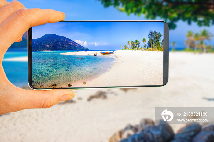 tropical beach picture on smartphone - travel concept - travel blog