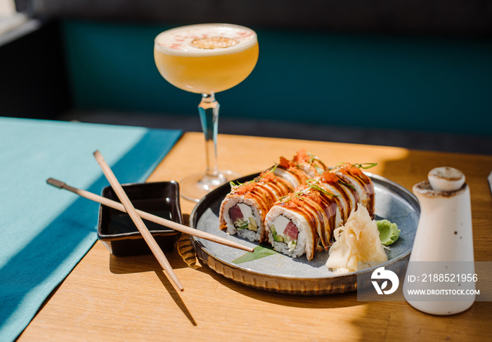 Delicious sushi rolls with a seafood on the served table at the restaurant