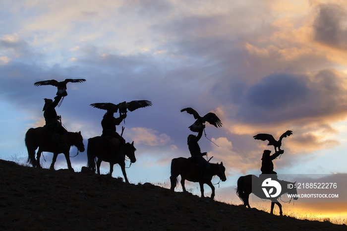 Silhouette of Mongolian Eagle Hunters near Ulgii, Mongolia