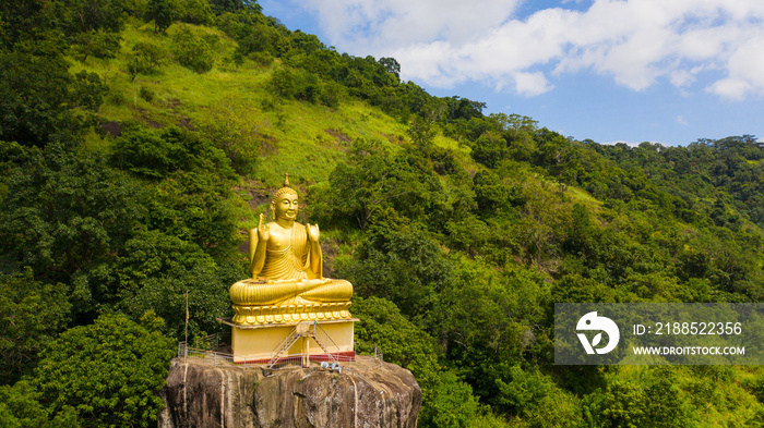 Buddha statue at a hill slope near Aluvihare Rock Temple. Aluvihara Rock Temple, Matale Sri Lanka.