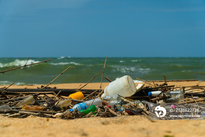 Discarded plastic debris trash pollution after sea swell storm, environmental nature waste. Negombo, Sri Lanka.