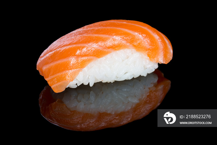 Sushi nigiri with salmon on black background with reflection. Ja