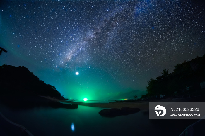 starry night milky way sky at rock beach with the green light At   Hinta Hinyai   Koh nang yuan island, koh tao, Surat Thani Province , Thailand