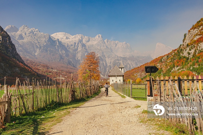 Village walking way with beautiful view of mountain alps. Theth, Albania