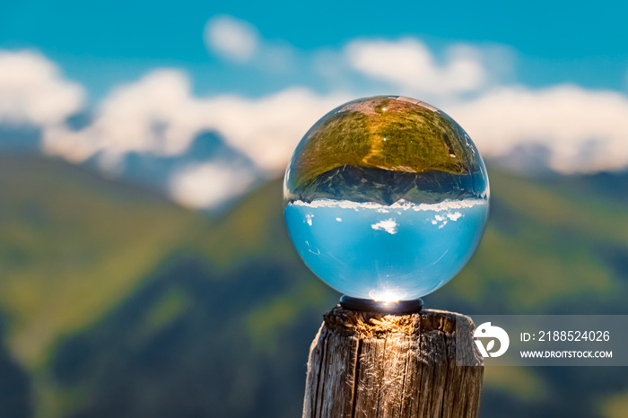 Crystal ball alpine landscape shot at the famous Schattberg mountain, Saalbach-Hinterglemm, Salzburg, Austria