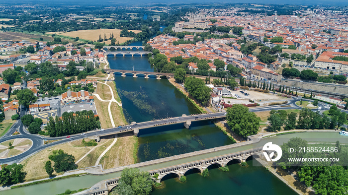 Aerial top view of Beziers town, river and bridges from above, South France