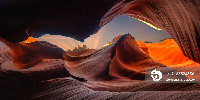 Panorama beautiful wide angle view of amazing sandstone formations in famous Antelope Canyon on a sunny day with blue sky near the old town of Page at Lake Powell, American Southwest, Arizona, USA