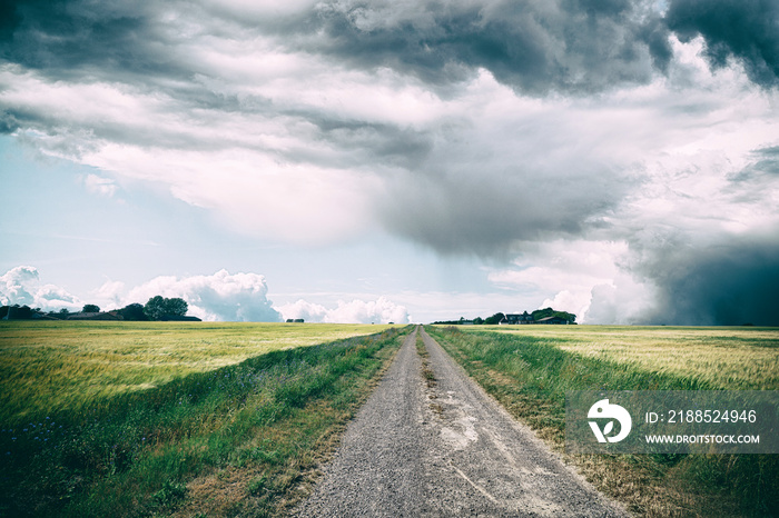 Rural landscape with dark clouds over a countyside