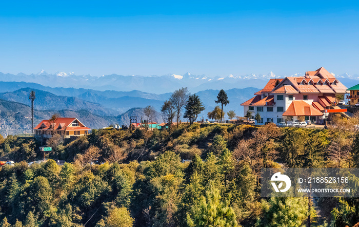 Tourist hotels on hill top with scenic Himalaya mountain landscape at Himachal Pradesh, India