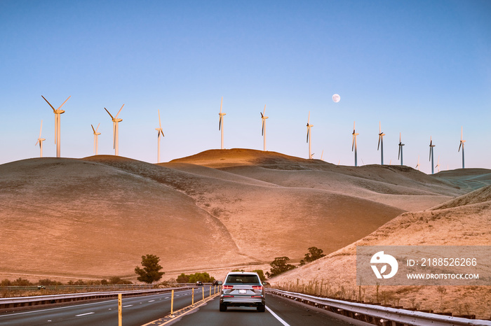 Sunset view of wind turbines visible on the golden hills of Contra Costa County; San Francisco Bay Area, California