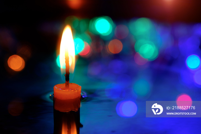 Candle light in the water in the pool on the twilight.